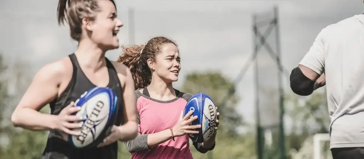 Women playing rugby