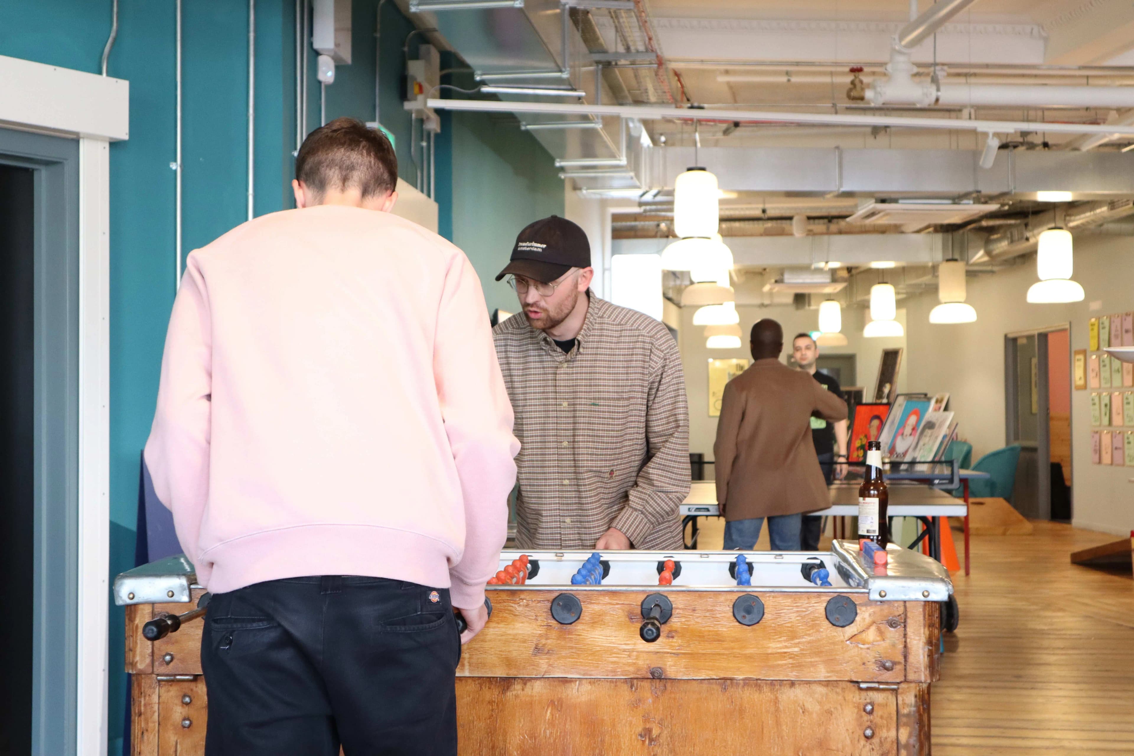 Team playing foosball